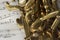 Macro Shot of Tenor Saxophone on sheet music