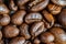 Macro shot of whole bean organic smooth medium dark roast coffee