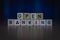 Macro shot of wooden cubes on a table showing words OPEN BANKING