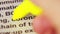 Macro shot of the word `coronovirus` highlighted with a yellow marker