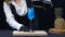 Macro of a skilled bartender hand pouring a Blue Hawaii in glass. Comestible.