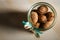 macro standard open glass jar filled with whole walnuts