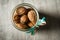 macro standard open glass jar filled with whole walnuts