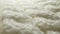 Macro. textile background. white wool knit fabric texture