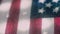 A Macro Ultra Closeup stylized pan over backlit American Flag & fabric