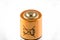 Macro on used AA battery with non-recyclable symbol