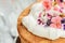 Macro of Victoria Sponge Cake with Whipped Cream and Sugared Flowers