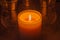 Macro view of a glowing candle flame in a darkened room