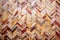 macro view of herringbone-patterned tiles