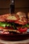 Macro view homemade burger made with hashbrown potatoes, salad, beef patty, cheese, tomatoes, concept of menu for restaurant in