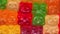 Macro view with rotation of colorful gummy bear shaped candies.candy background.