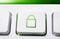 Macro Of A White Button With Green Closed Security Lock Icon