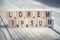 Macro Of The Words Lorem Ipsum Formed By Wooden Blocks On A Wooden Floor