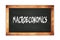 MACROECONOMICS text written on wooden frame school blackboard