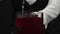 Macrography of a female bartender pour red syrup in glass with ice. Comestible.