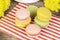 Macrons in various colors on paper near flowers
