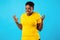 Mad African Woman Freaking Out Looking Angrily Posing, Blue Background