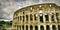 Mad clouds and Colisseum old building in Rome city, Italy