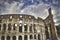 Mad clouds and Colisseum old building in Rome city, Italy