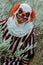 mad evil clown in front of a rustic house