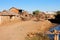 Madagascar, Antananarivo suburb with clay houses and sand road