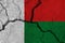 Madagascar flag on the cracked earth
