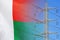 Madagascar flag on electric pole background. Increasing energy consumption, energy crisis in Madagascar. Price energy are getting