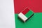 Madagascar flag is pictured on a matchbox that lies on a large flag