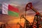 Madagascar oil industry concept. Industrial illustration - Madagascar flag and oil wells with the red and blue sunset or sunrise