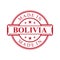 Made in Bolivia label icon with red color emblem on the white background