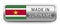 MADE IN SURINAME metallic badge with national flag isolated on a white background.