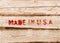 Made in USA. Red label on wooden box