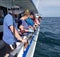 Madeira Beach, Florida, U.S.A - November 2, 2021 - A group of fisherman next to the each other on the fishing boat