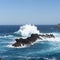 Madeira island wild nature, wave hitting volcanic rocks