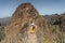 MADEIRA, PORTUGAL - JUNE 30, 2015: Young girl on the winding mountain trekking path at Pico do Areeiro, Madeira, Portugal.