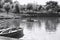 Madeira, Portugal: a woman is taking a foto to her son on a rowboat in the lake