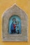 The Madonna and Child in diving masks - modern street art in medieval wine portal Buchette del vino
