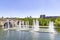 Madrid Rio Park. Views of the Madrid RÃ­o park next to the Manzanares river and green vegetation around it. Roads with bridges