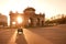 Madrid, Spain - April 05, 2010: Motorcyclist passing by in front of sunlight at Puerta de Alcala in Plaza de la Independencia.