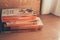 Madrid, Spain, May 10 2021: Stack of old vintage Penguin books on wooden shelf.