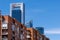 MADRID, SPAIN - MAY 12, 2019: Contrast between the modern towers of Madrid`s financial district and the surrounding older