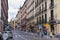 MADRID, SPAIN - MAY 28, 2014: Calle Mayor, Old Madrid city centre, busy street with people and traffic