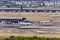 Madrid, Spain, October 30, 2022: Panoramic view of Madrid Barajas Airport with planes operating on the runways.