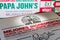 Madrid, Spain - SEPTEMBER 12, 2018: Papa John`s pizza box with Papa John`s website at background. Papa John`s Pizz