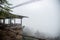 Mae Hong Son,Thailand - November 8, 2019 : View point of the local noodle restaurant hanging legs with the mist