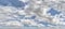 Maelstrom of cirrus clouds in blue sky, panorama