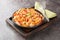 Mafaldine also known as reginette or simply mafalda or mafalde pasta in Creamy Tomato Sauce with capers and baked papper closeup