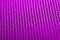 Magenta background. Mesh fabric texture. Macro