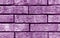 Magenta color brick wall texture.