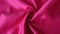 Magenta color satin fabric texture seamless with beautiful closeup and shiny detail fabric